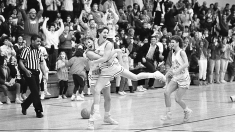 Burke, No. 11, celebrates while a player at Providence. Photo courtesy of Providence.